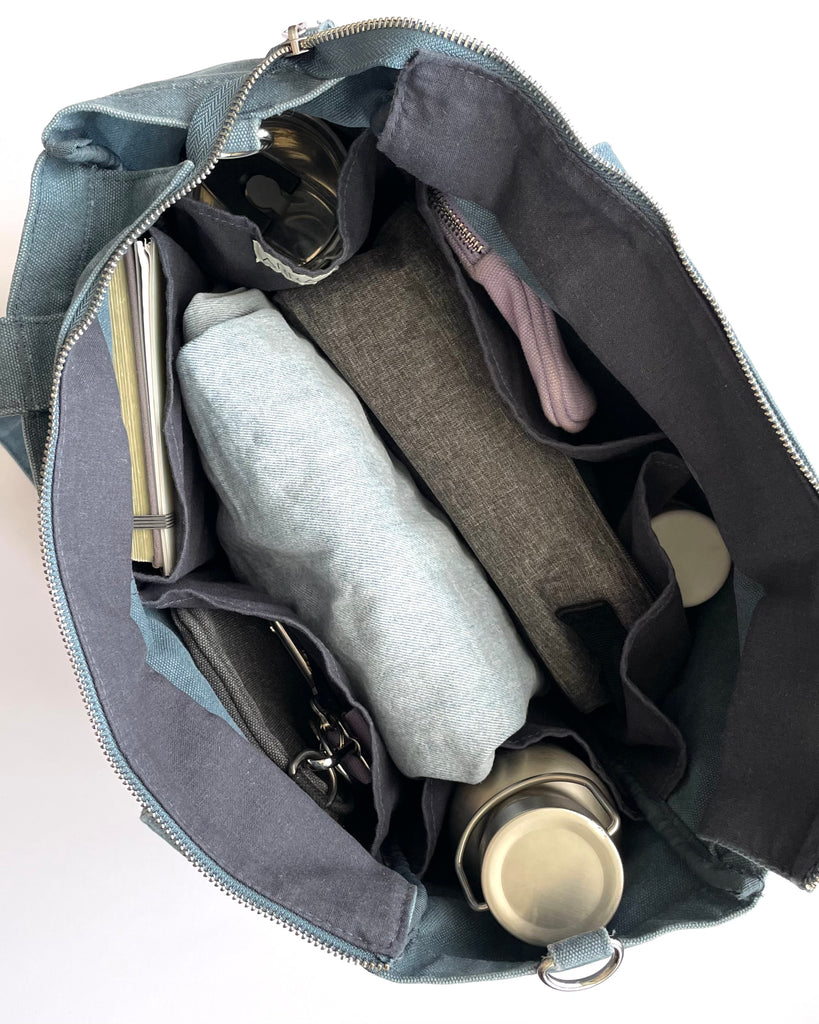 Everyday Zip Top tote bag with six internal pockets, in a versatile and casual style. Organise the chaos of everyday life. From baby bag, to work bag it is an everyday essential.