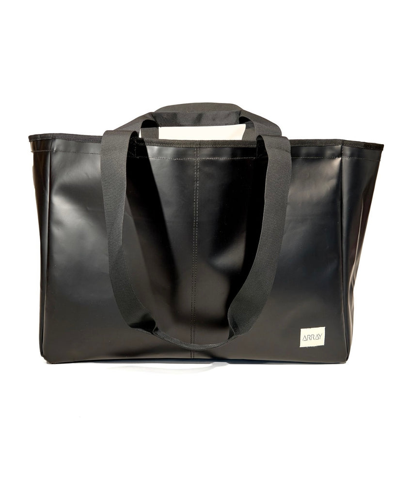 Huge water resistant bag for pool or beach, with pockets.