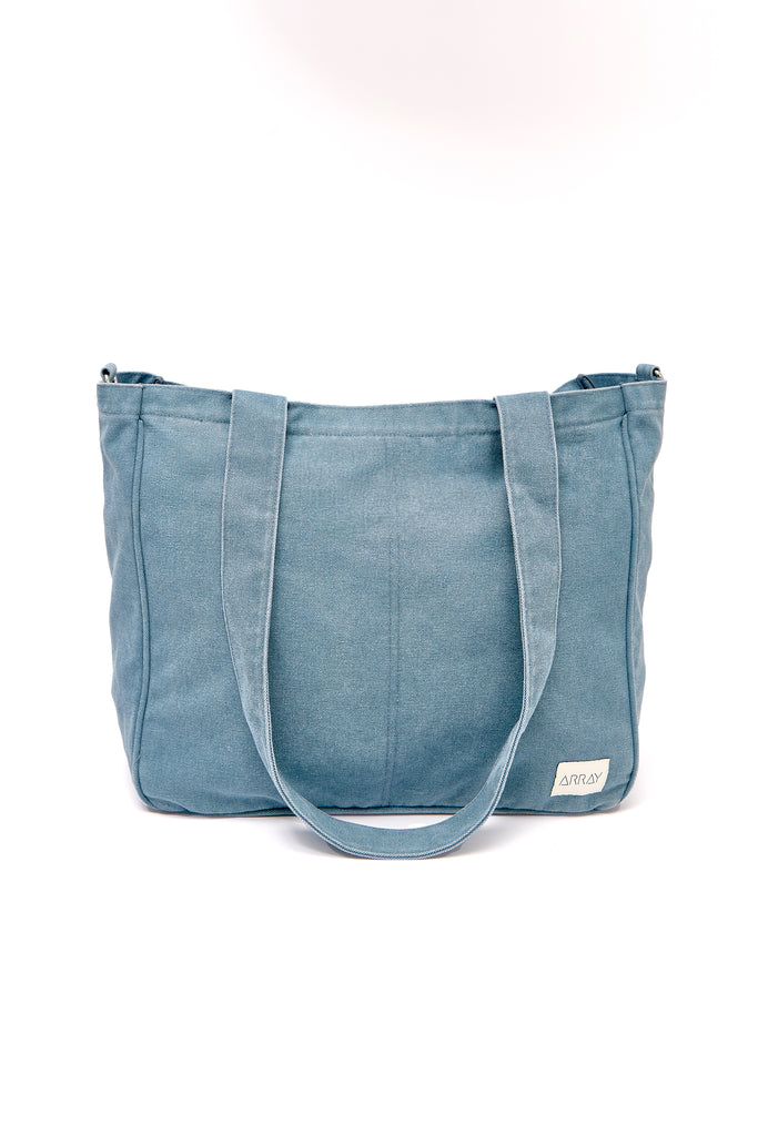 Larger version of the bestselling everyday zip top pocket tote, with six internal pockets, in a versatile and casual style. Large enough to fit a laptop, lunchbag or large water bottle, it makes the perfect bag for work or study, or the ultimate mumbag.