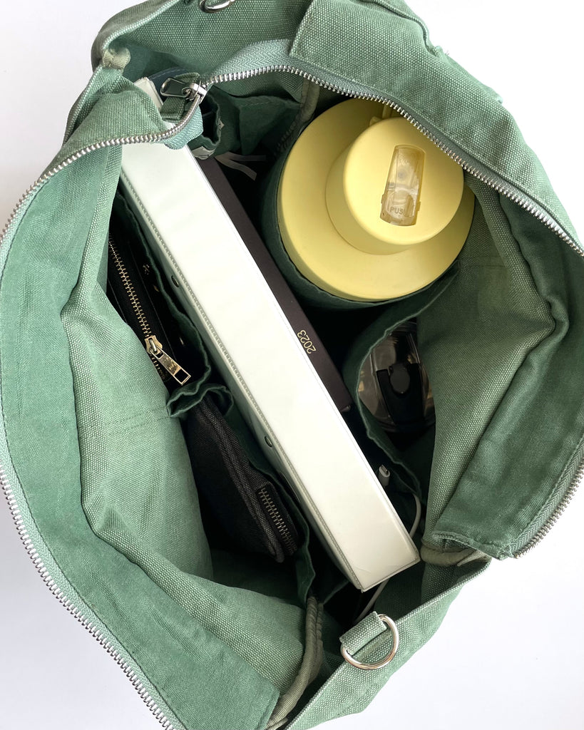 Larger version of the bestselling everyday zip top pocket tote, with six internal pockets, in a versatile and casual style. Large enough to fit a laptop, lunchbag or large water bottle, it makes the perfect bag for work or study, or the ultimate mumbag.