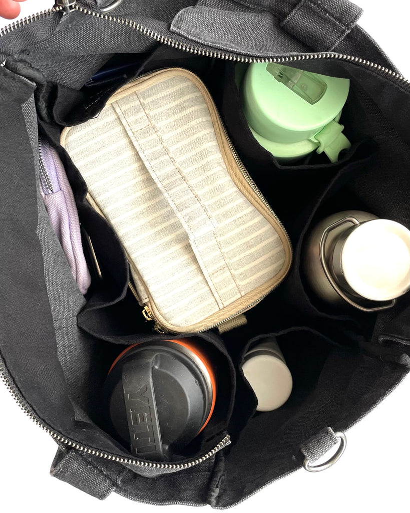 Everyday Zip Top tote bag with six internal pockets, in a versatile and casual style. Organise the chaos of everyday life. From baby bag, to work bag it is an everyday essential.