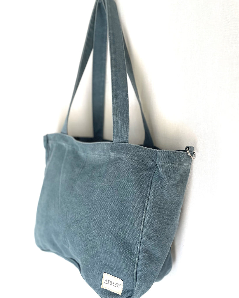 Larger version of the bestselling everyday zip top pocket tote, with six internal pockets, in a versatile and casual style. Large enough to fit a laptop, lunchbag or large water bottle, it makes the perfect bag for work or study, or the ultimate mumbag.
