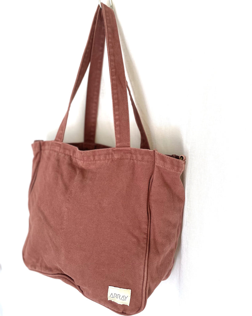 Organise the chaos of everyday life with POCKETS! From baby bag, to work bag it is an everyday essential. The Everyday Zip Top Pocket Tote bag has six internal pockets, available in canvas or cord, in a versatile and casual style.