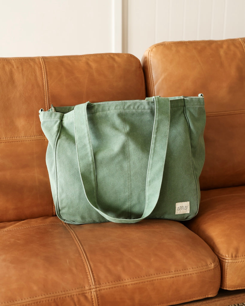 Larger version of the bestselling everyday zip top pocket tote, with six internal pockets, in a versatile and casual style. Large enough to fit a laptop, lunchbag or large water bottle, it makes the perfect bag for work or study, or the ultimate mumbag.