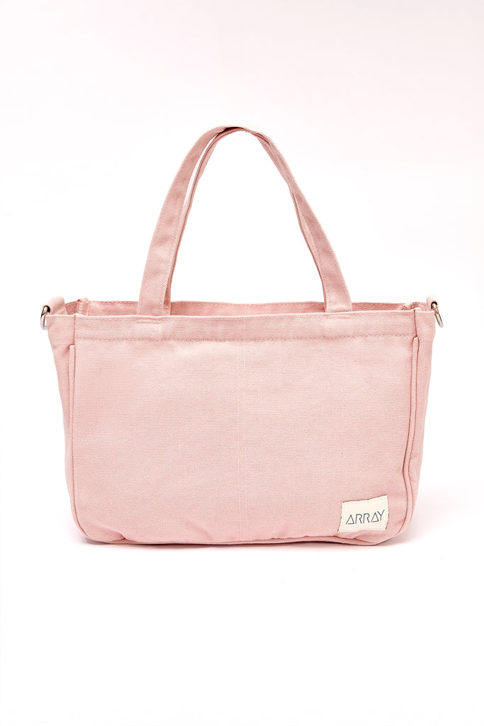 Smaller version of the bestselling everyday zip top pocket tote, with six internal pockets, in a versatile and casual style. The perfect bag for days when you don’t need to carry everything.