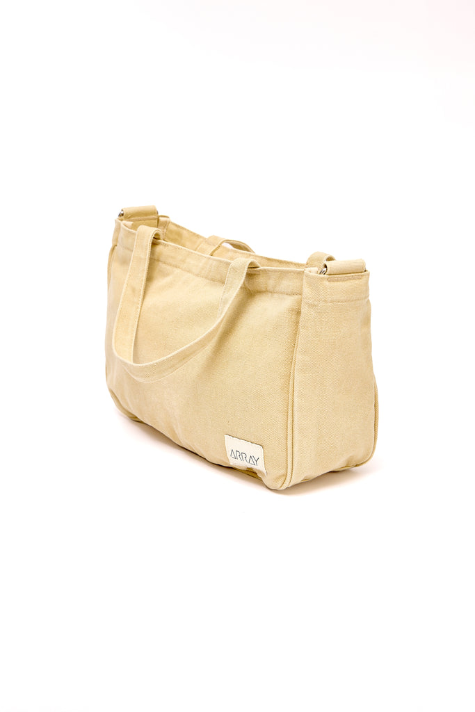 Smaller version of the bestselling everyday zip top pocket tote, with six internal pockets, in a versatile and casual style. The perfect bag for days when you don’t need to carry everything.