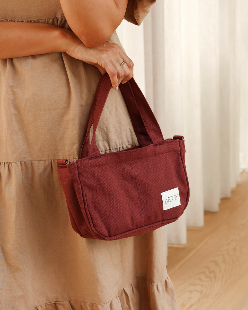 the compact, yet mighty, pint-sized version of our bestselling Everyday Pocket Tote