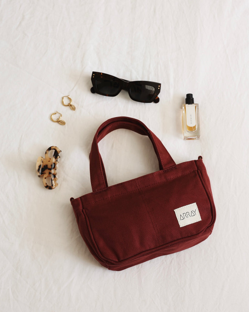 Small version of the bestselling totes, with six pockets.