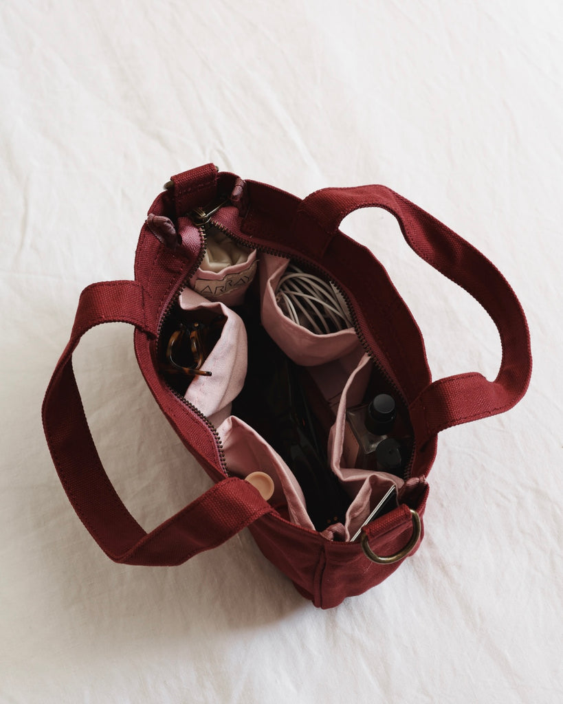 Small version of the bestselling totes, with six pockets.