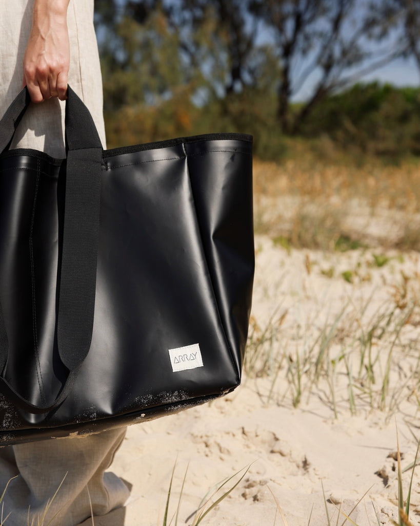 Huge water resistant bag for pool or beach, with pockets.