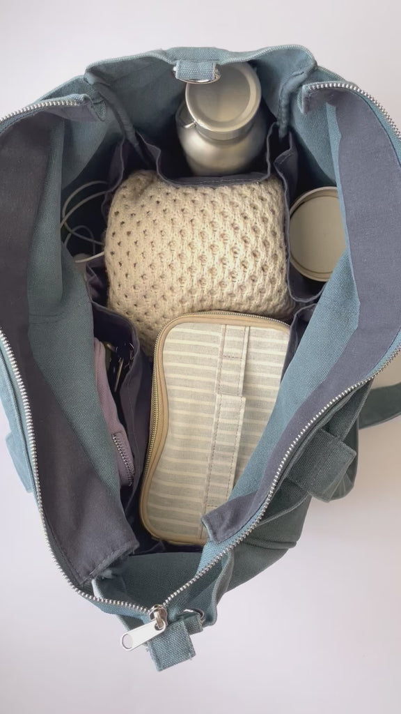 Larger version of the bestselling everyday zip top pocket tote, with six internal pockets, in a versatile and casual style. Large enough to fit a laptop, lunchbag or large water bottle, it makes the perfect bag for work or study, or the ultimate mumbag.