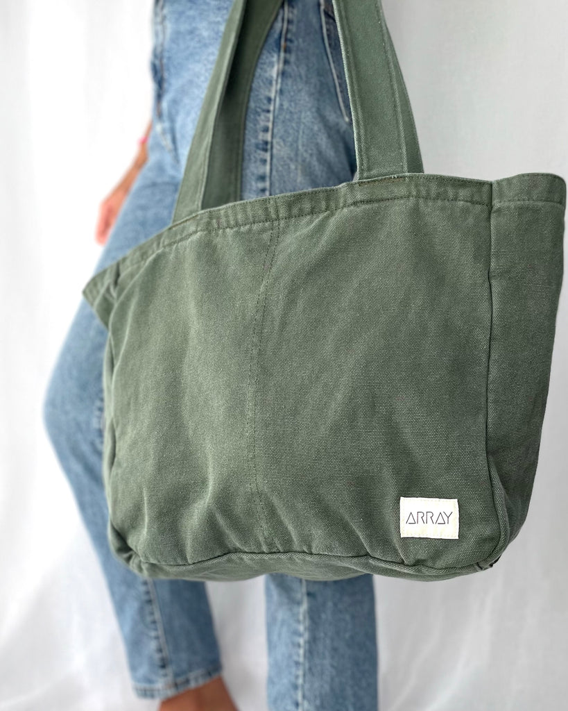 Everyday Zip Top tote bag with six internal pockets, in a versatile and casual style. Organise the chaos of everyday life. From baby bag, to work bag it is an everyday essential.